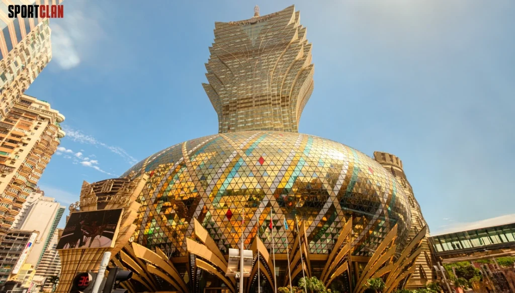 Grand Lisboa Iconic mirrored dome building with a tiered, crown-like tower rising above and glass triangle panels reflecting the city sky.